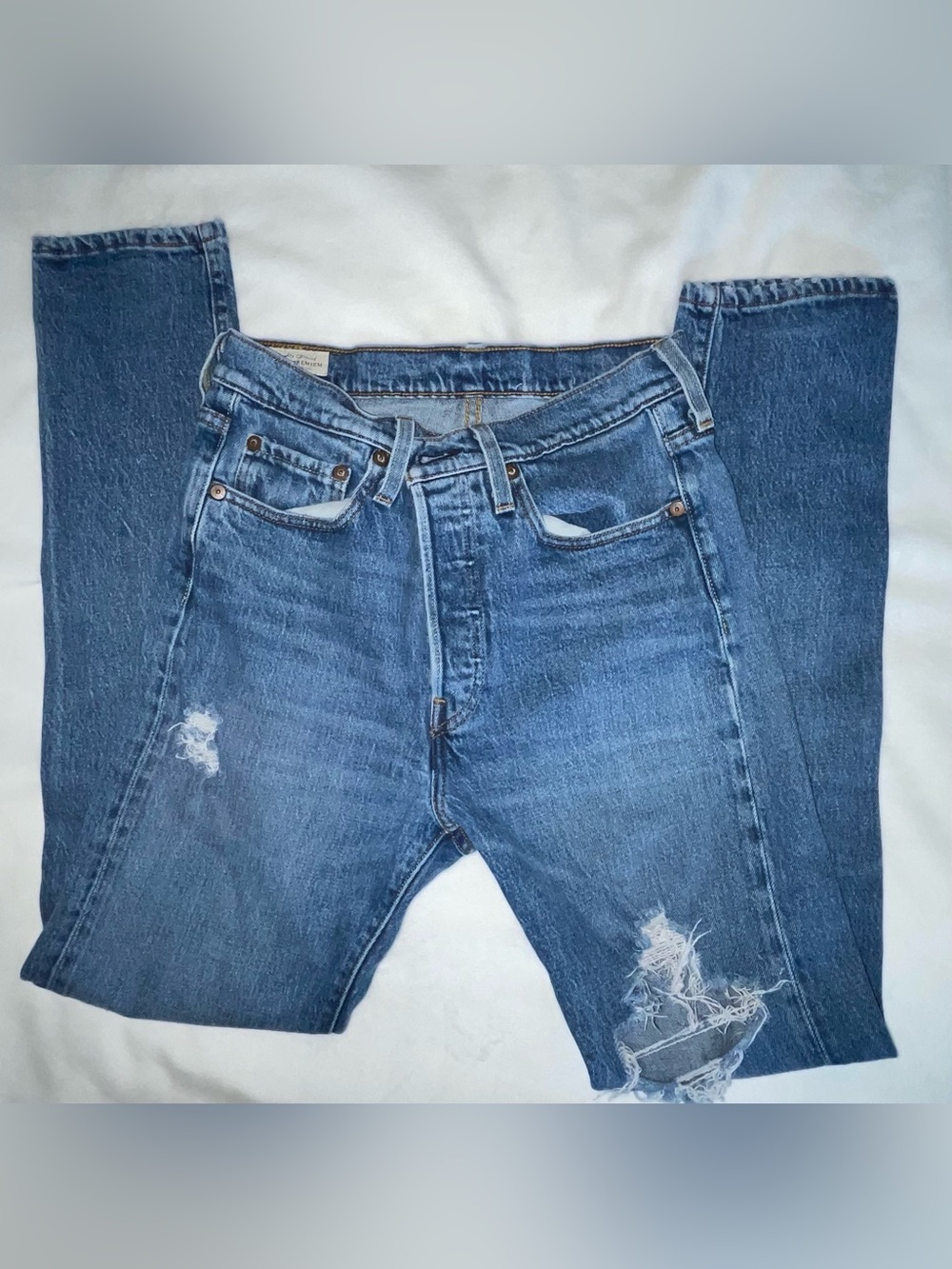 woman’s Distressed Blue Denim Jeans